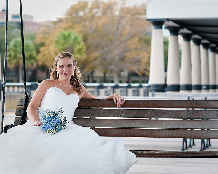 the bride is sitting on the bench