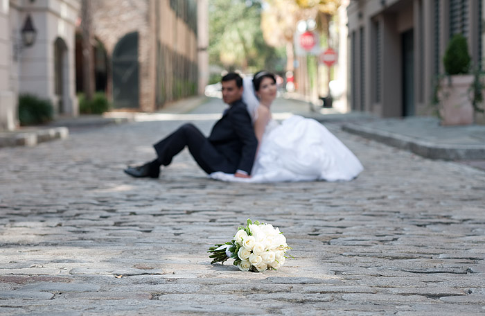 the wedding bouquet on the cobblestone street of charleston sc