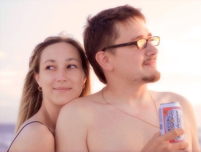 Couple portrait with a beer can