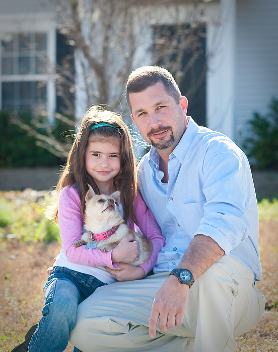 Father and daughter with a dog