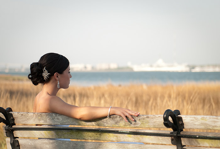 The bride is sitting on the bench