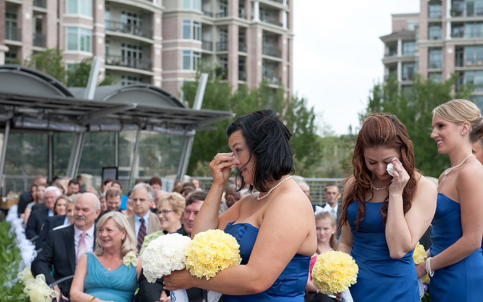 bridesmaids are crying at the wedding ceremony