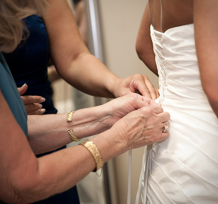 mother is helping with a wedding dress at Harborside East Mt. Pleasant